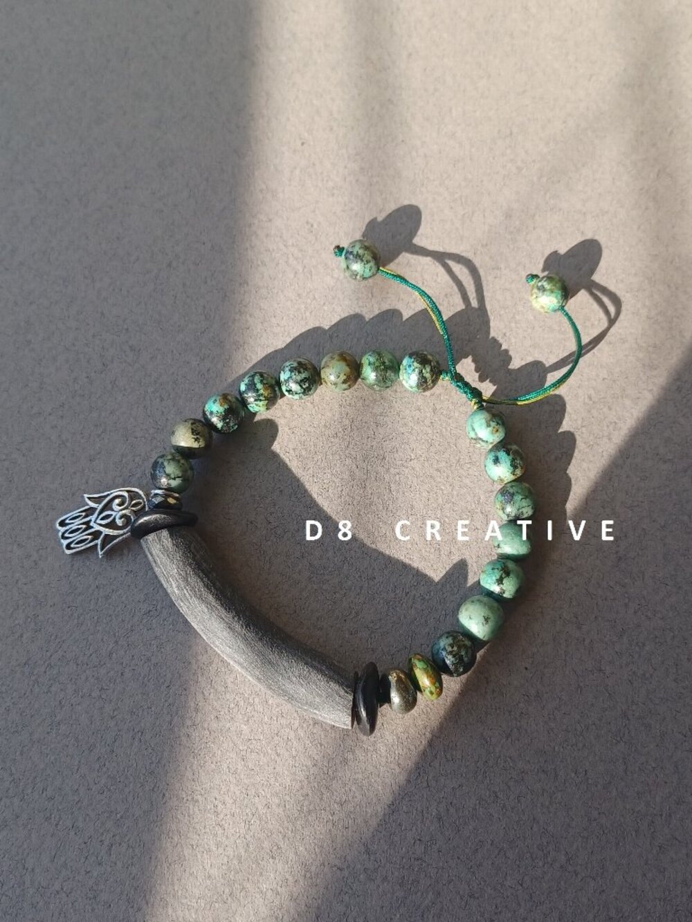 Handmade African turquoise with cara horn and sterling silver pendant bracelet